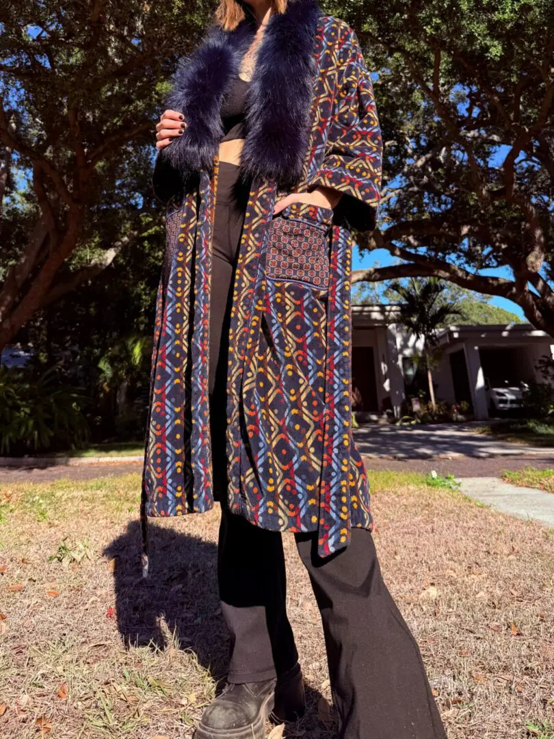 Person in patterned coat with fur collar