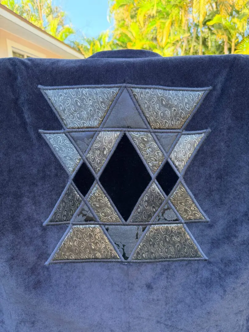 Blue fabric with mirrored Star of David patch