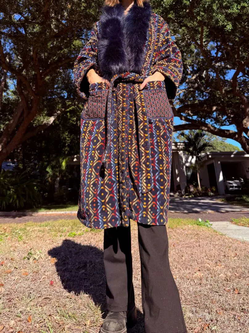 Person wearing patterned coat with fur collar