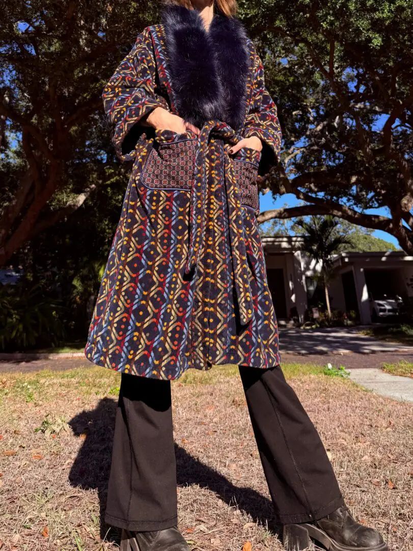 Person wearing patterned coat with fur collar