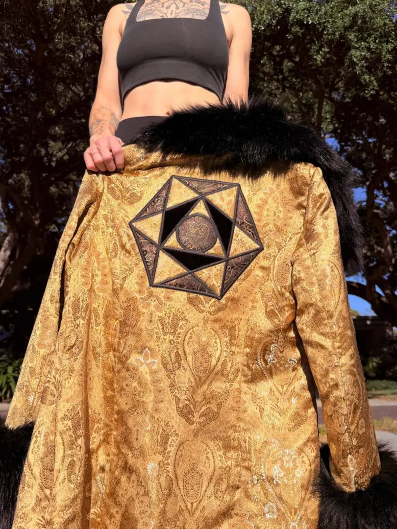 Gold brocade coat with geometric embroidery