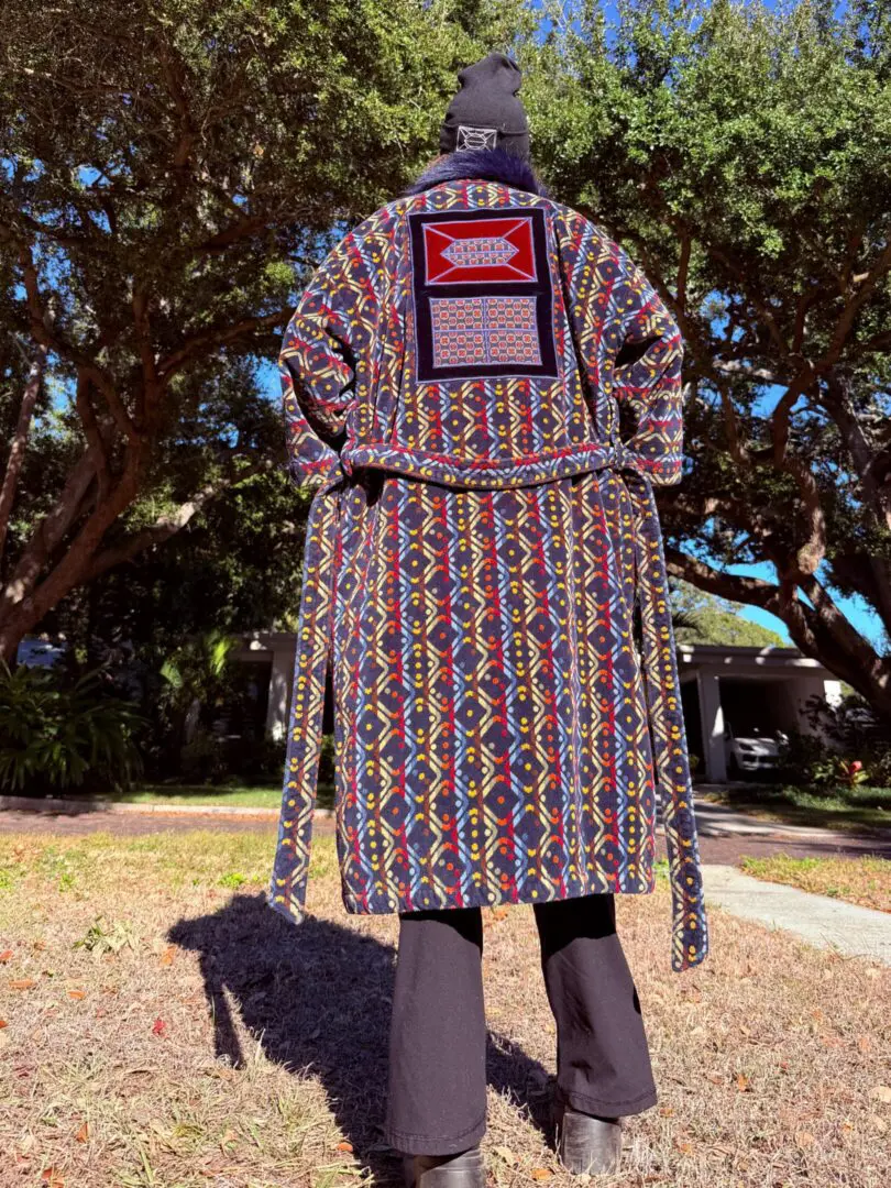 Back view of person in colorful patterned robe