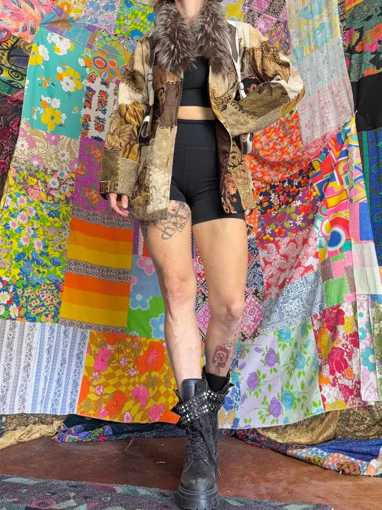 Person in patchwork coat and combat boots