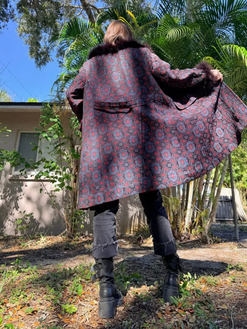 Back view of person in patterned coat