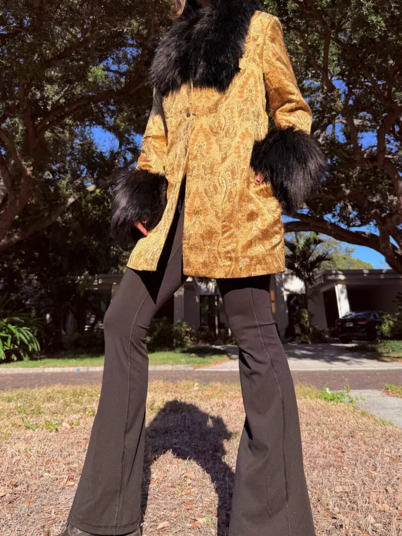 Gold brocade coat with black fur trim