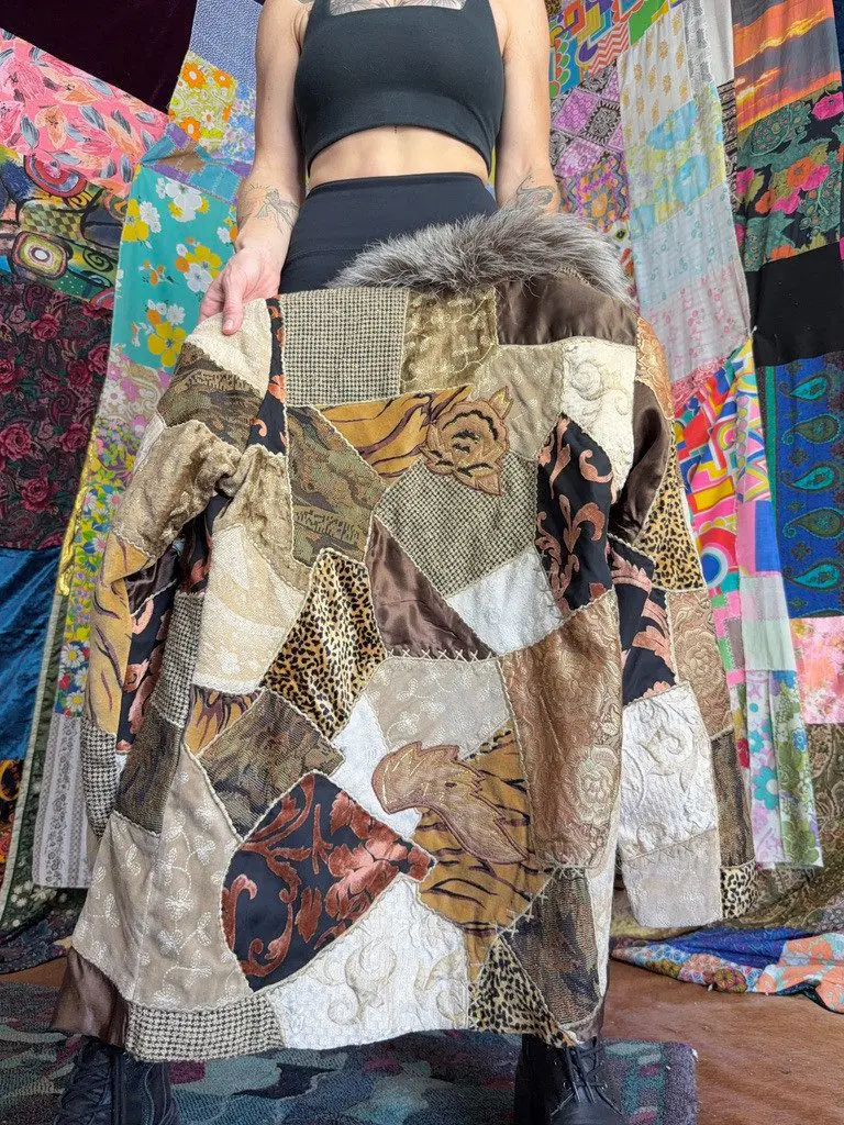Patchwork animal-print coat held before colorful backdrop