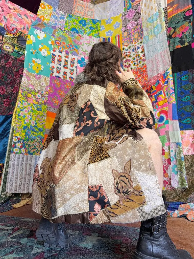 Back view of person wearing patchwork coat