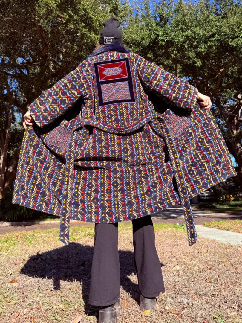 Back view of person in patterned coat