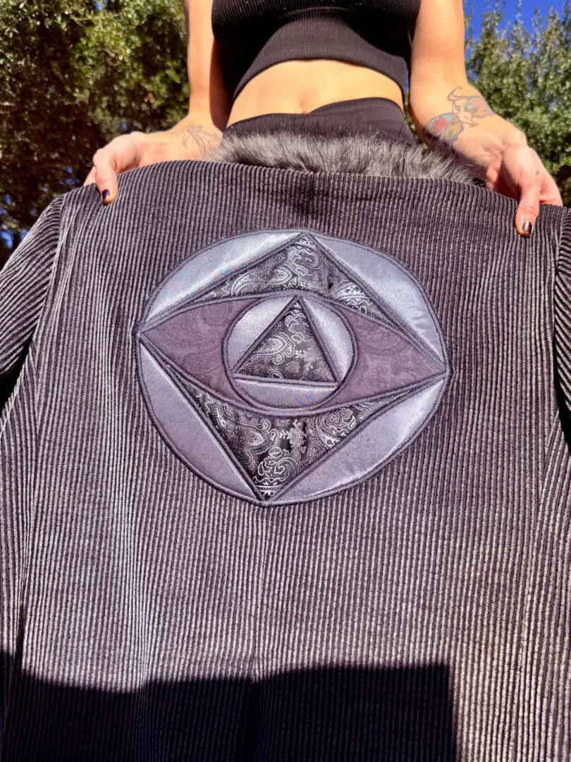 Corduroy jacket with embroidered circular geometric patch