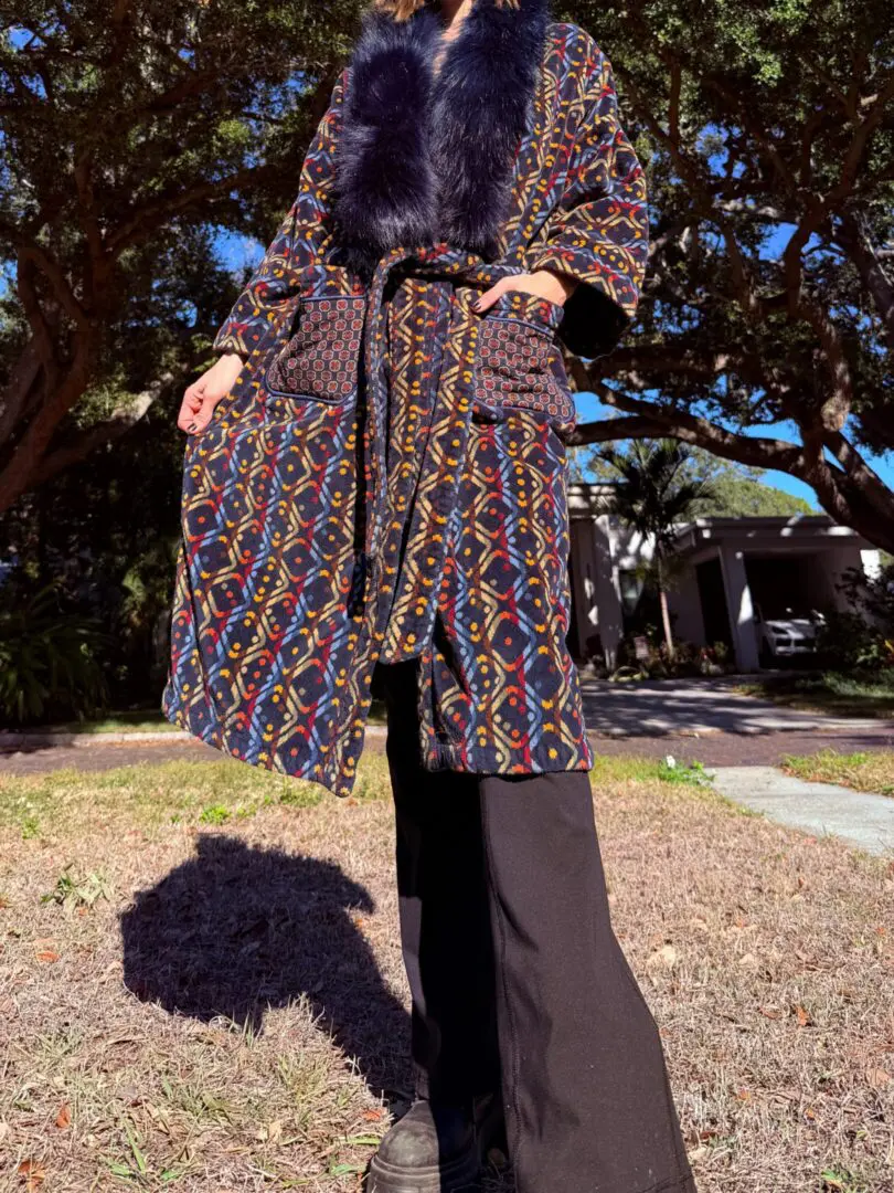 Person wearing patterned coat with fur collar