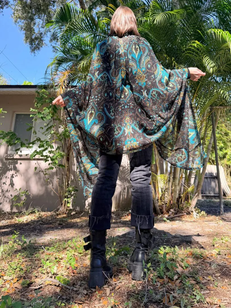 Person wearing paisley kimono, platform boots