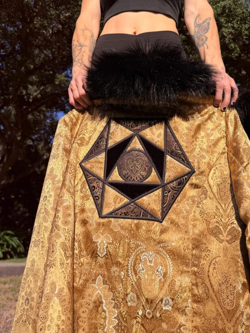 Gold embroidered coat with black fur collar