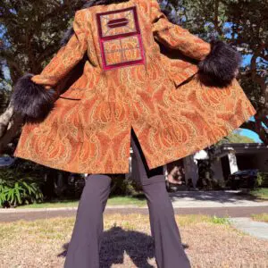 Orange paisley coat with black fur cuffs