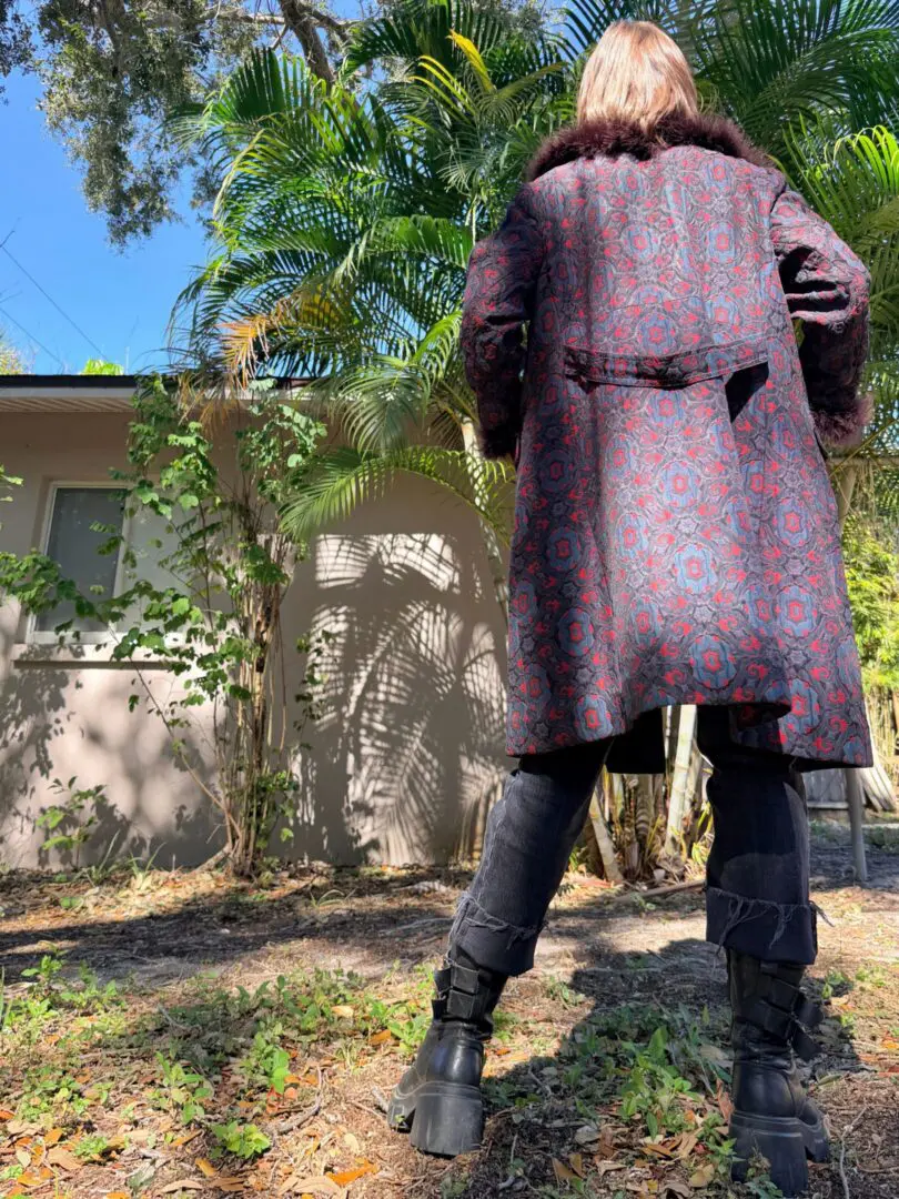 Back view of person in patterned coat