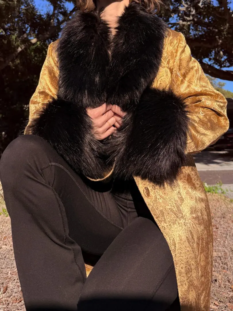 Gold brocade coat with black fur trim