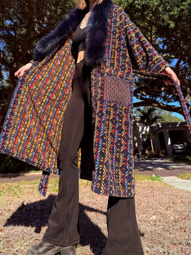 Person in patterned coat with fur collar