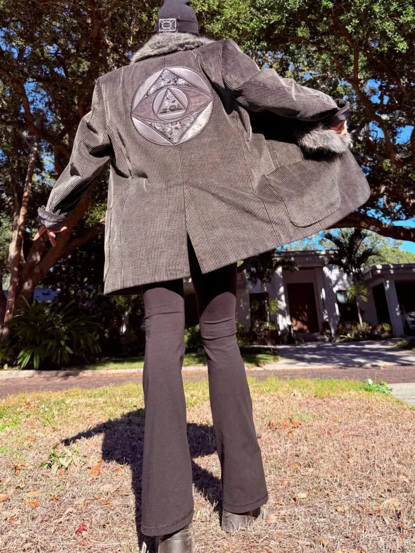 Person wearing corduroy jacket with circular patch