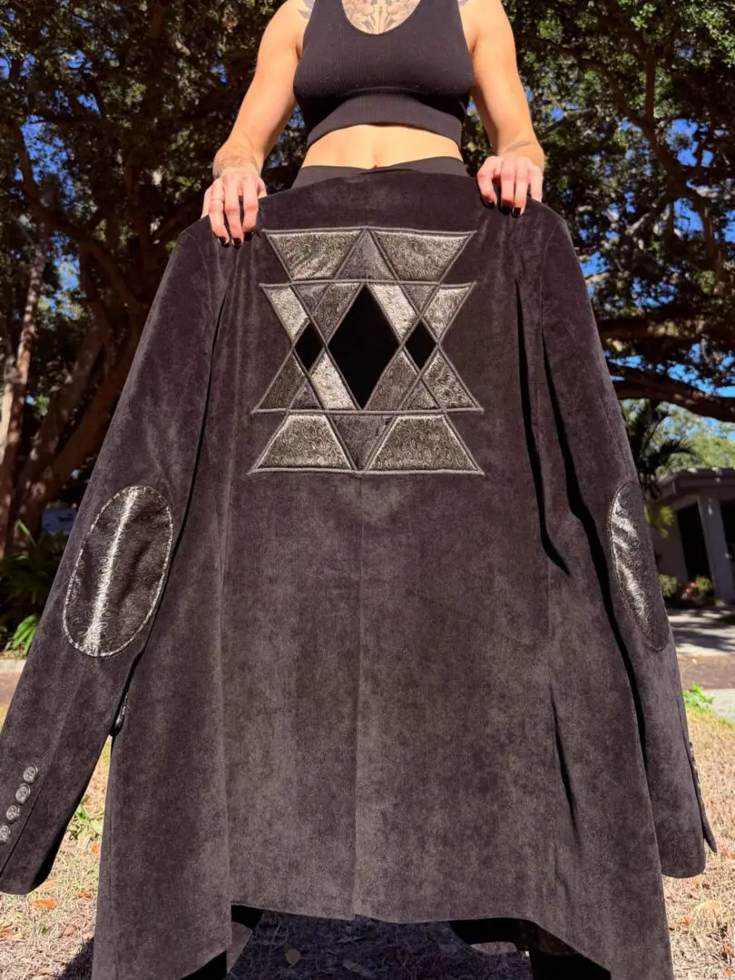 Black suede coat with geometric back patch