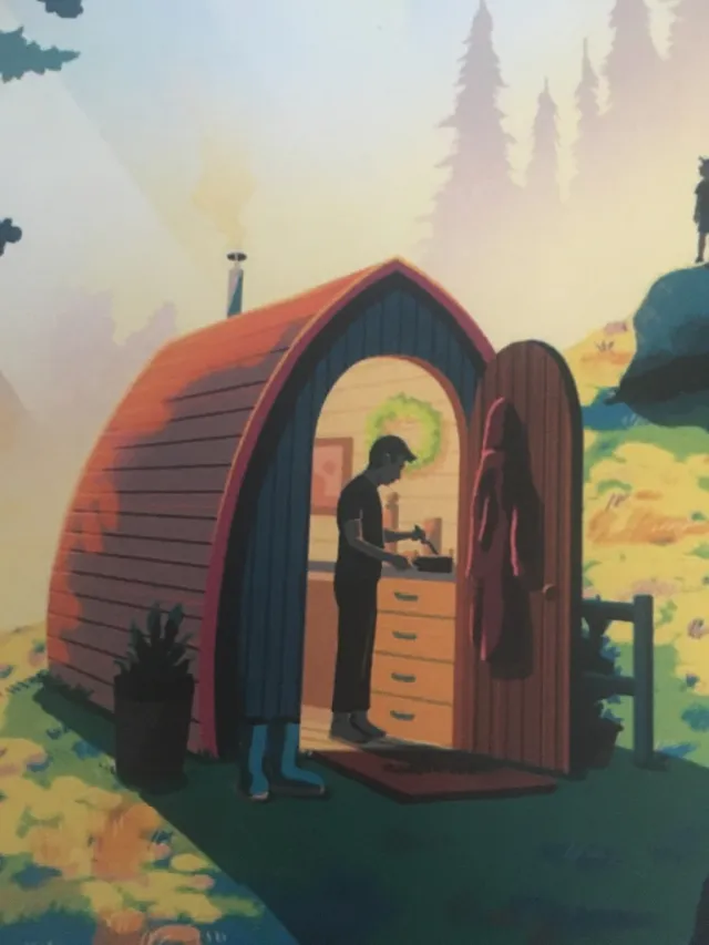 Person cooking inside small arched cabin